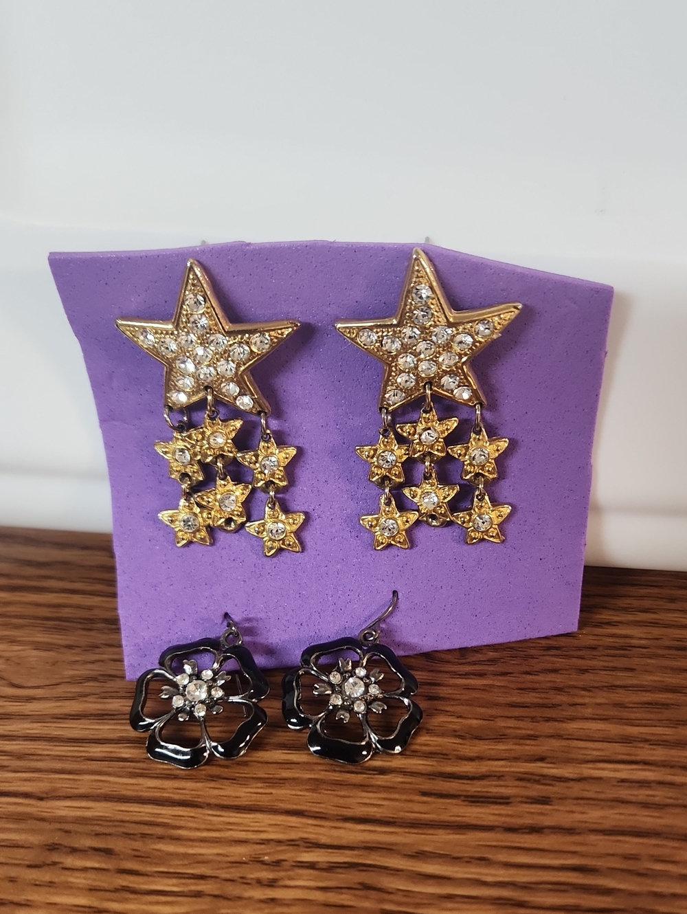 Gold Crystal Star Drop And Black Flower Earrings